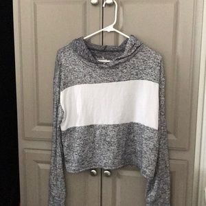 Cropped, light shirt with a hood